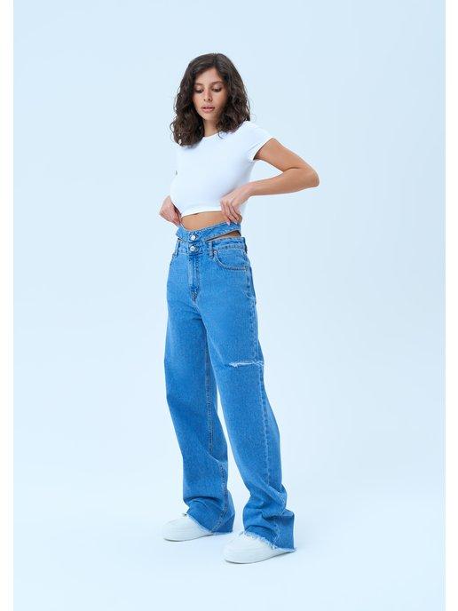 Широкие джинсы багги с вырезами на талии
